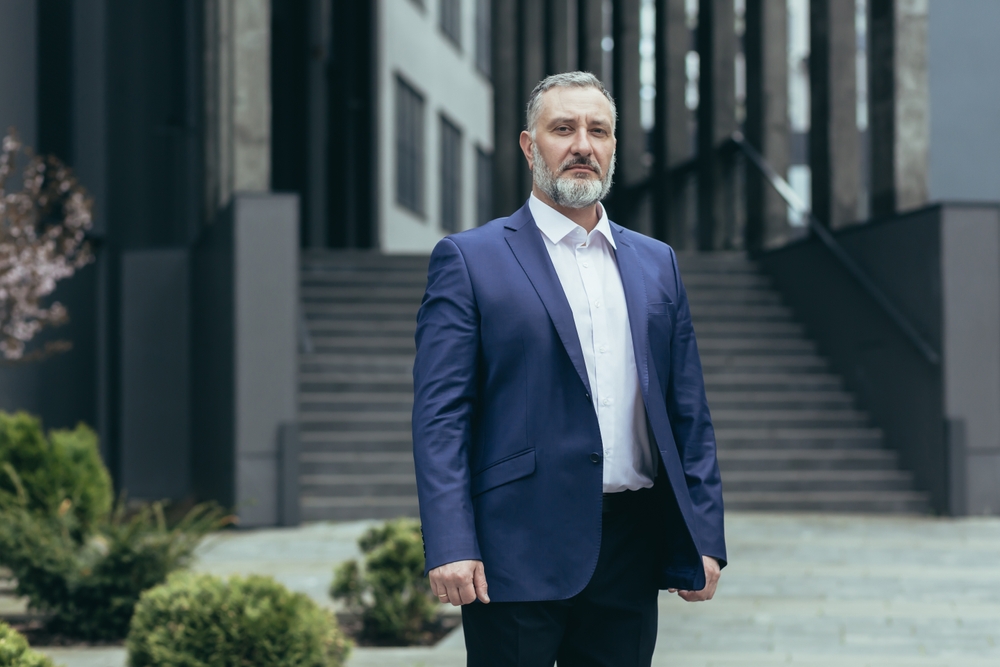 A male politician standing outside