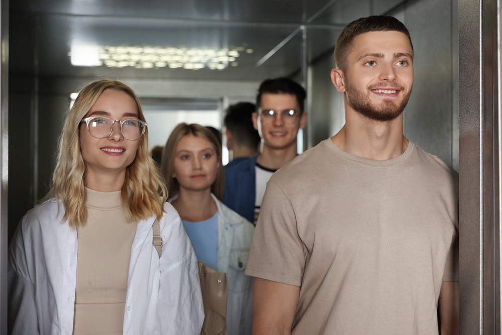 A group of young people in an elevator