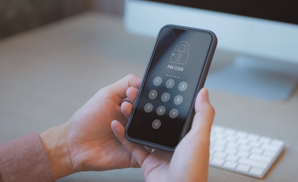 A locked phone screen waiting for the password to be typed in