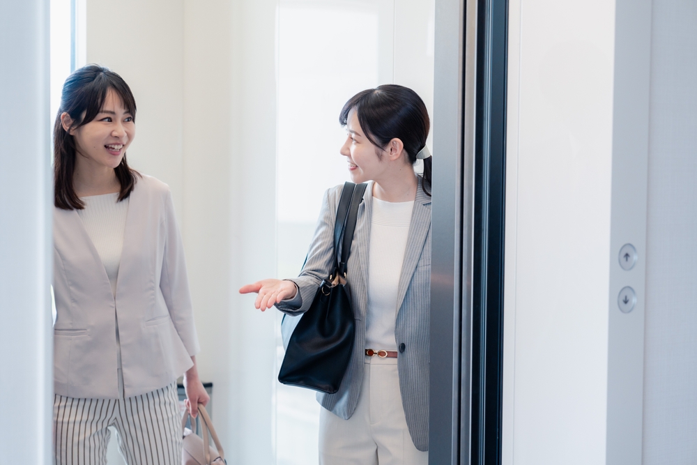 Two business women in an elevator