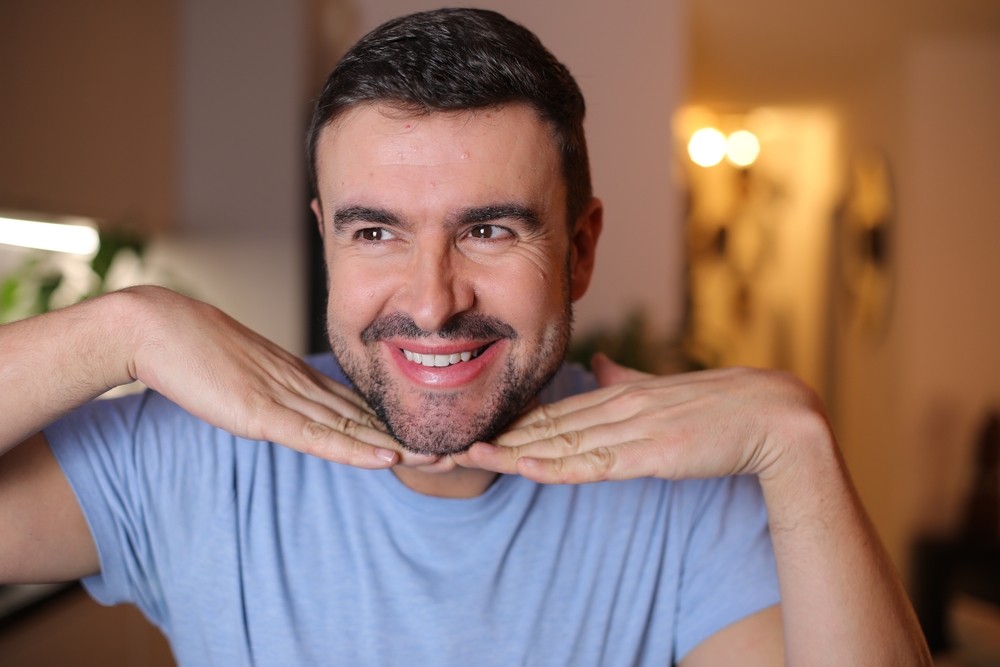 A narcissistic man showing off his perfect face