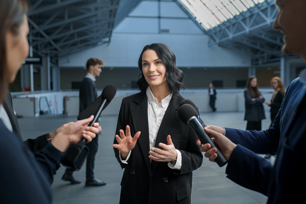 A busy female business woman being interviewed
