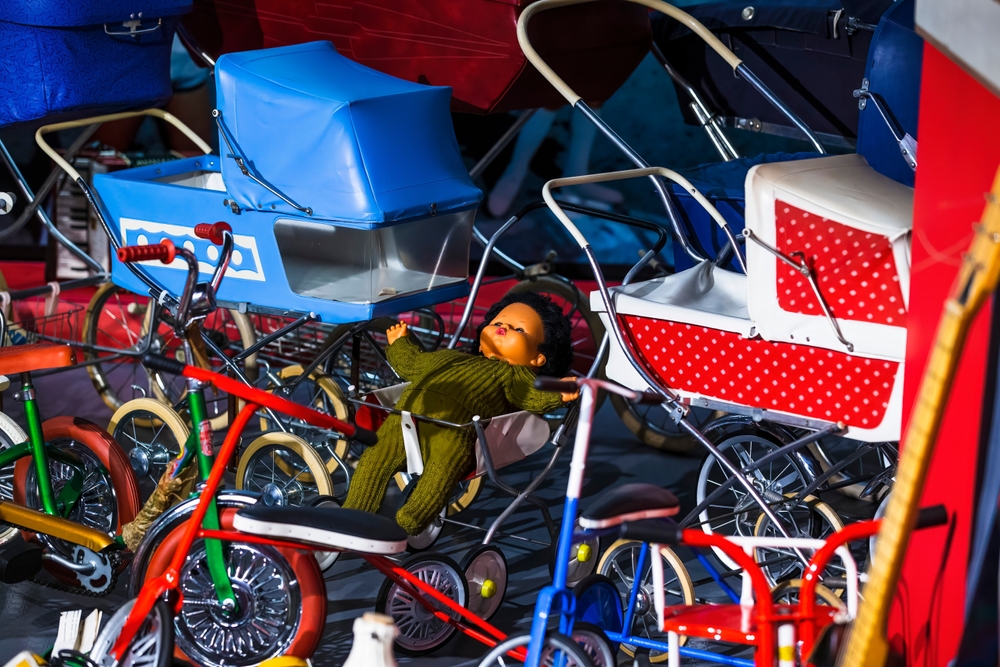 A collection of old baby strollers