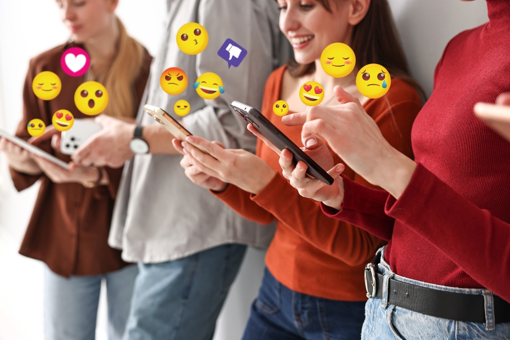 A group of young friends using emojis on social media