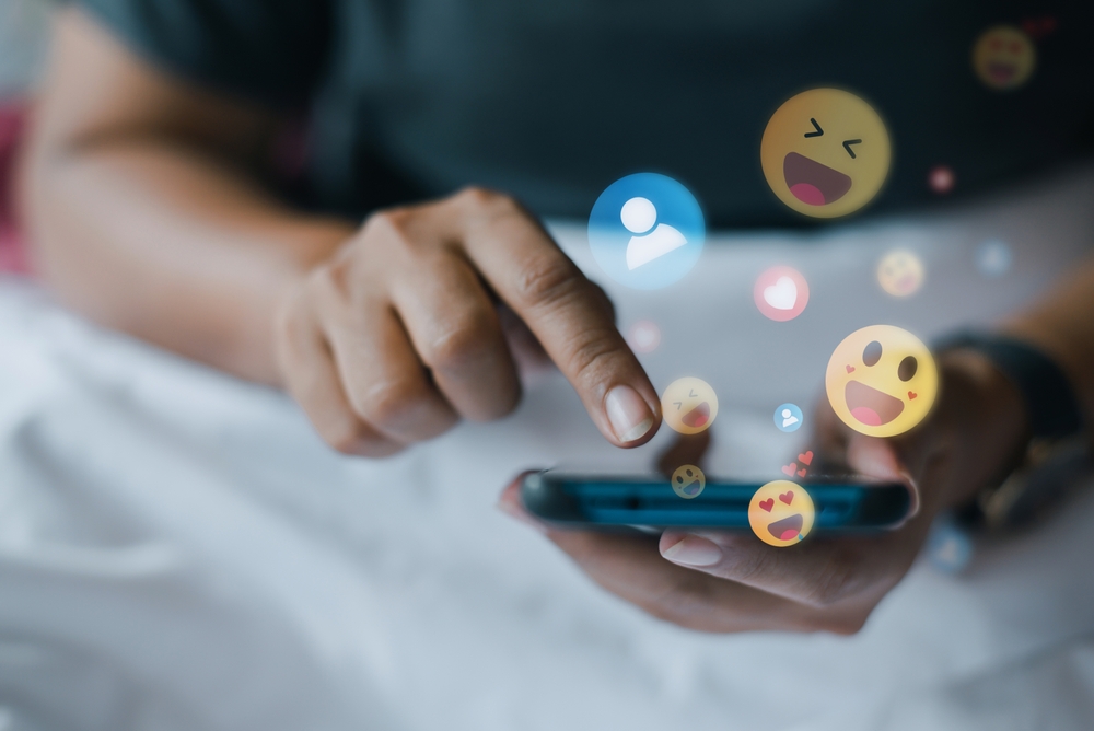 A handing chatting and using emojis