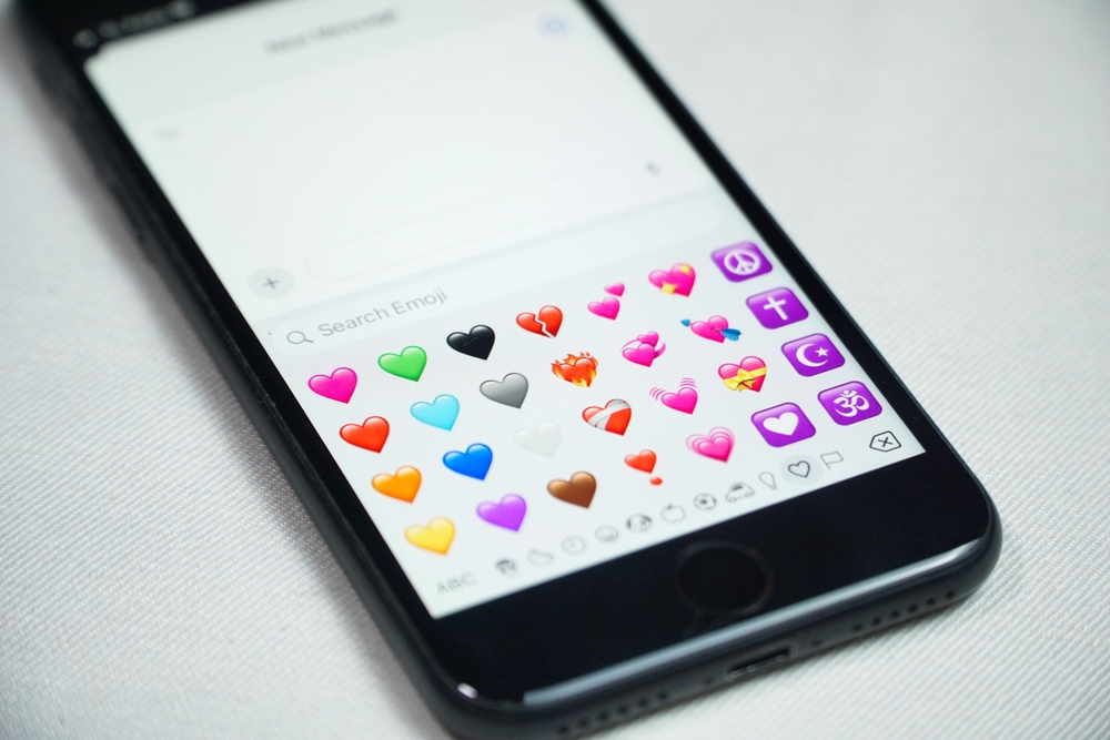 A phone messaging app showing heart emojis