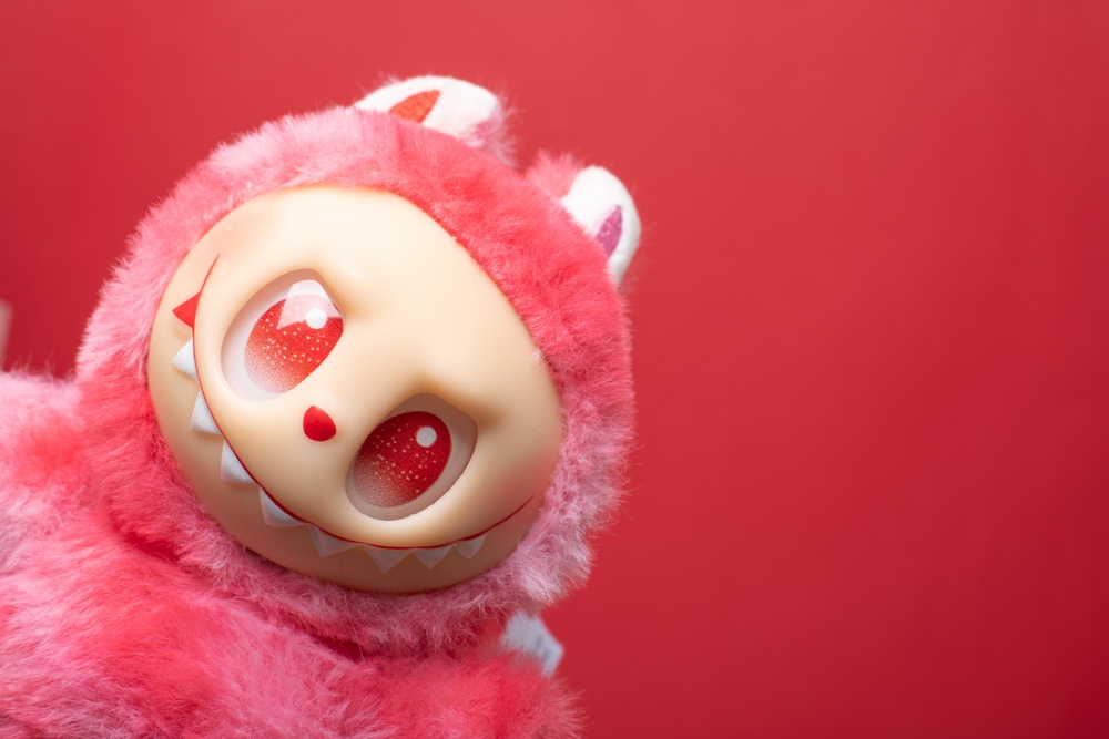 A pink labubu doll