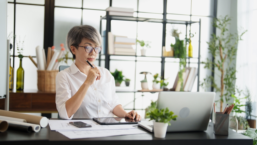 Senior Asian businesswoman at work