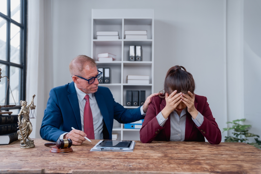A lawyer providing compassion and legal aid too a distressed young woman