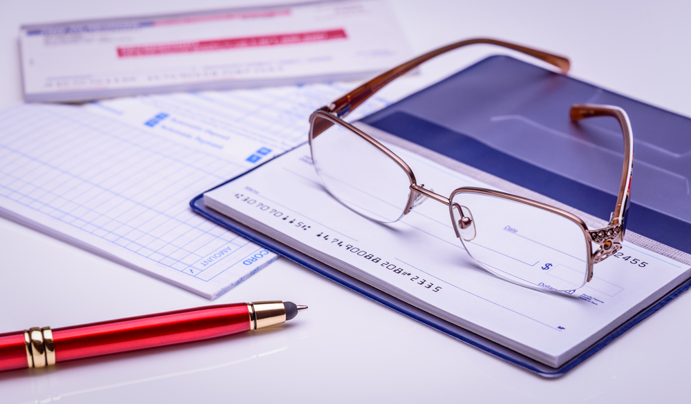 Image of checkbook to represent money and finance.