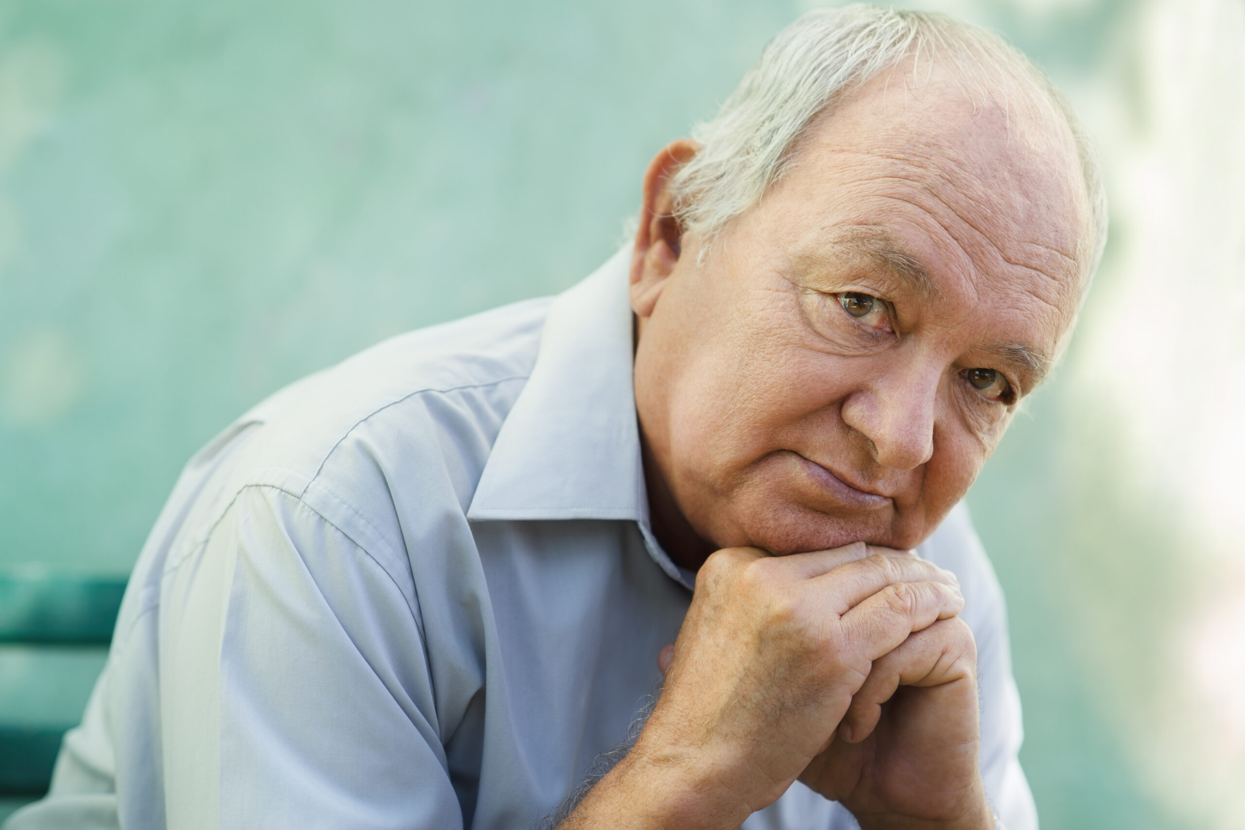 A mature man struggling with his thoughts.