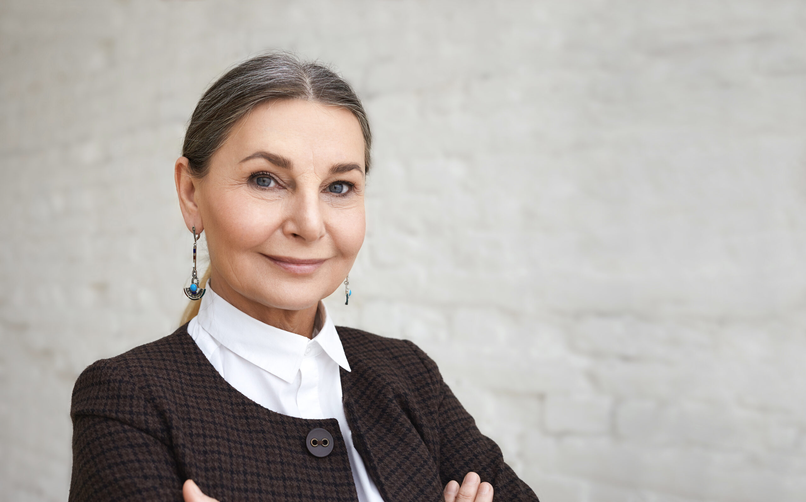 A confident mature woman in her office.