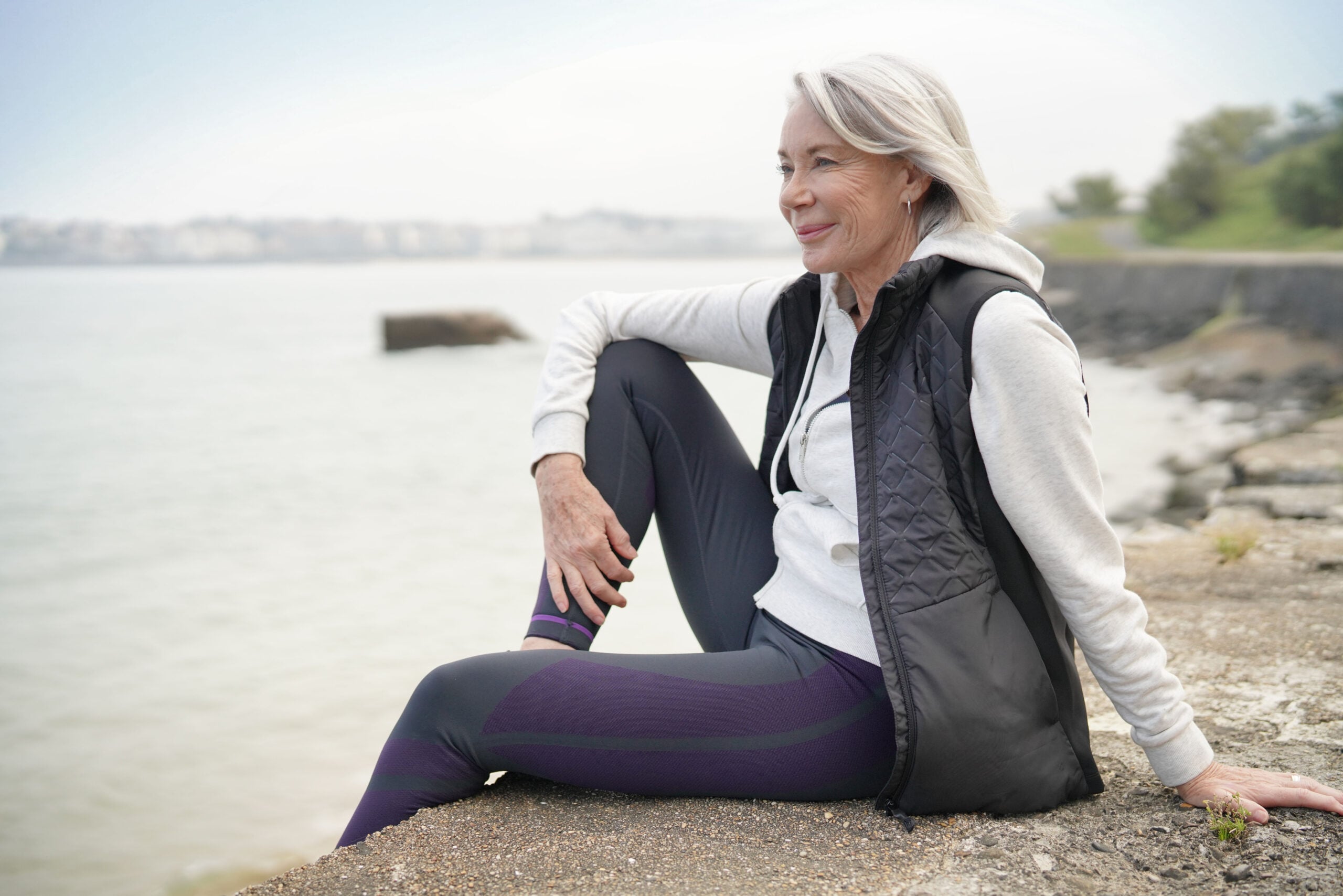 A mature woman out on a hike.