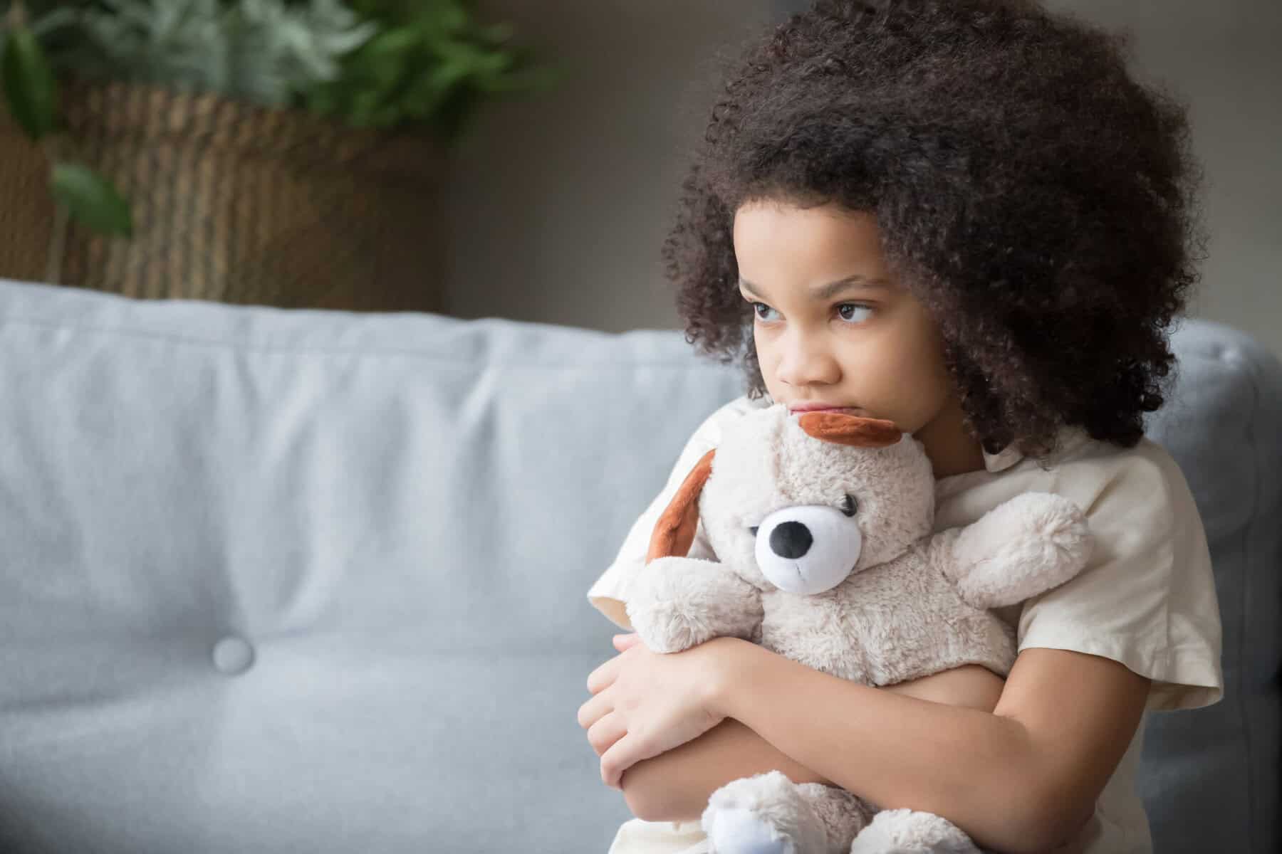 A small child feeling lonely at home.