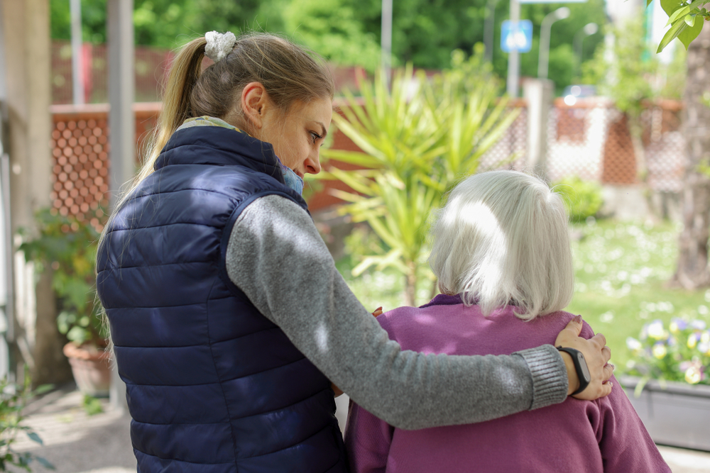A woman taking care of her old mother