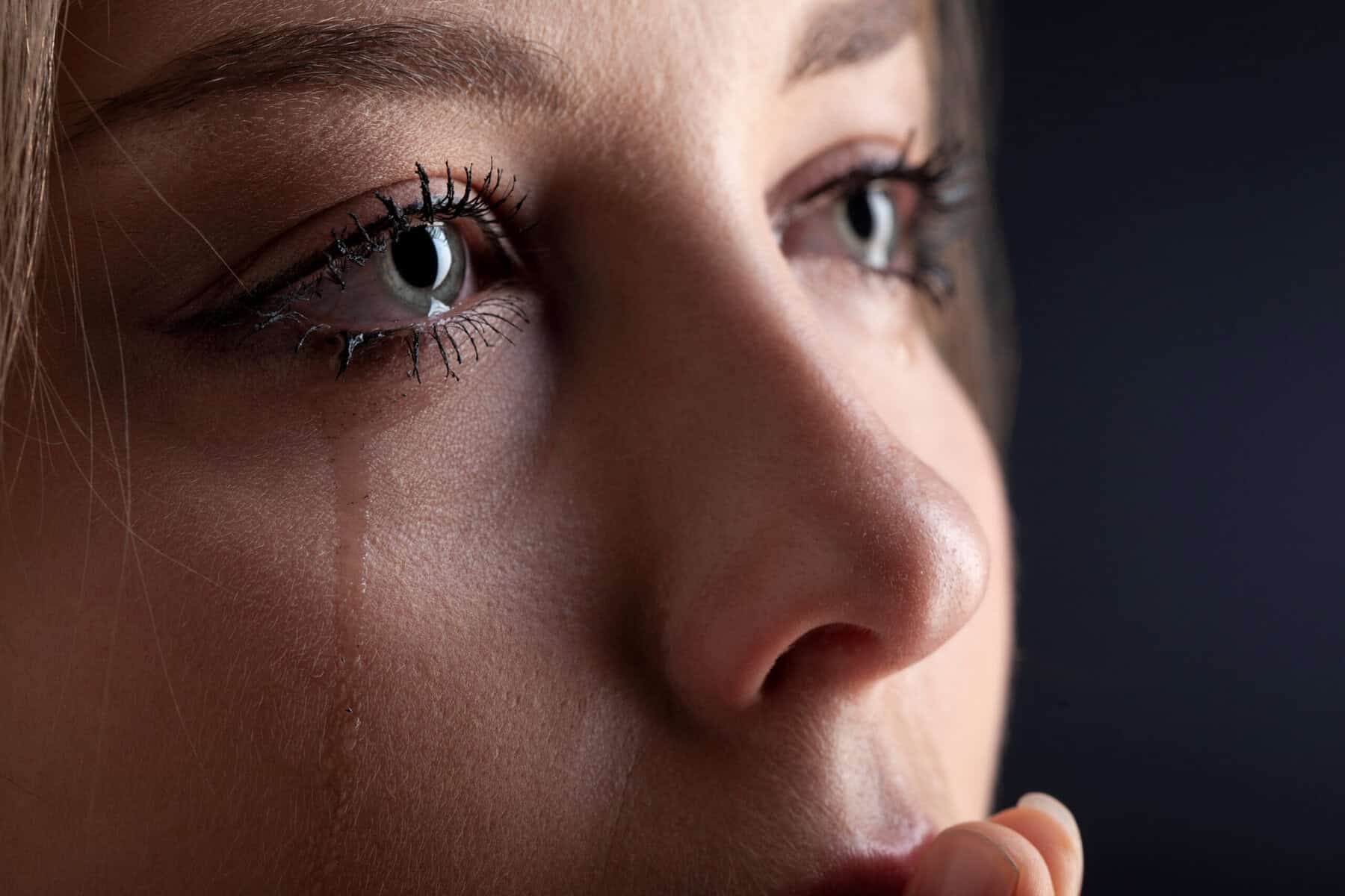 A woman grieving the loss of a parent.