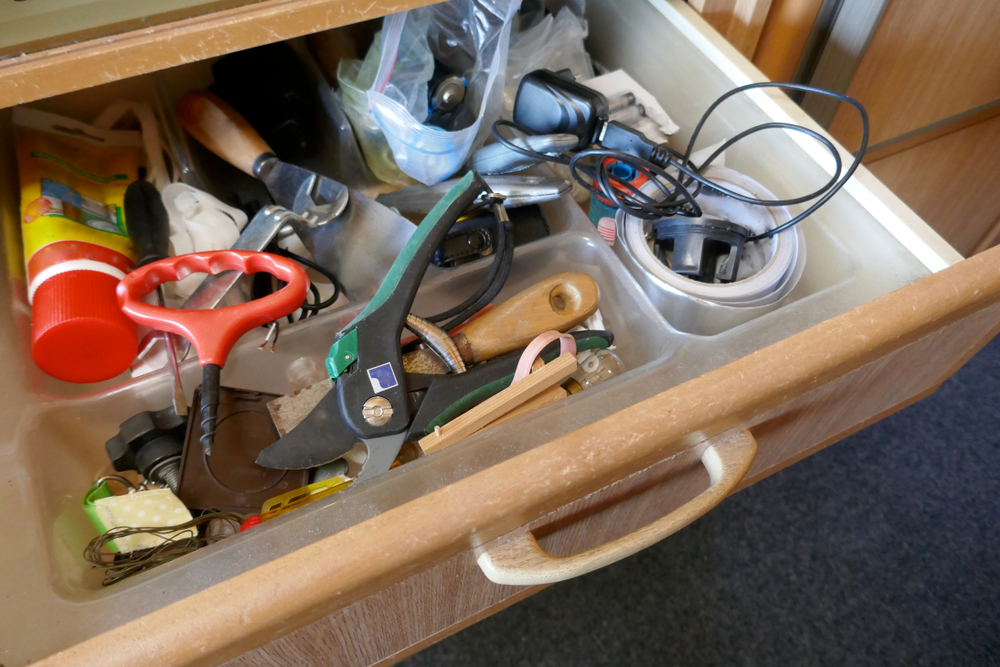 An untidy junk drawer