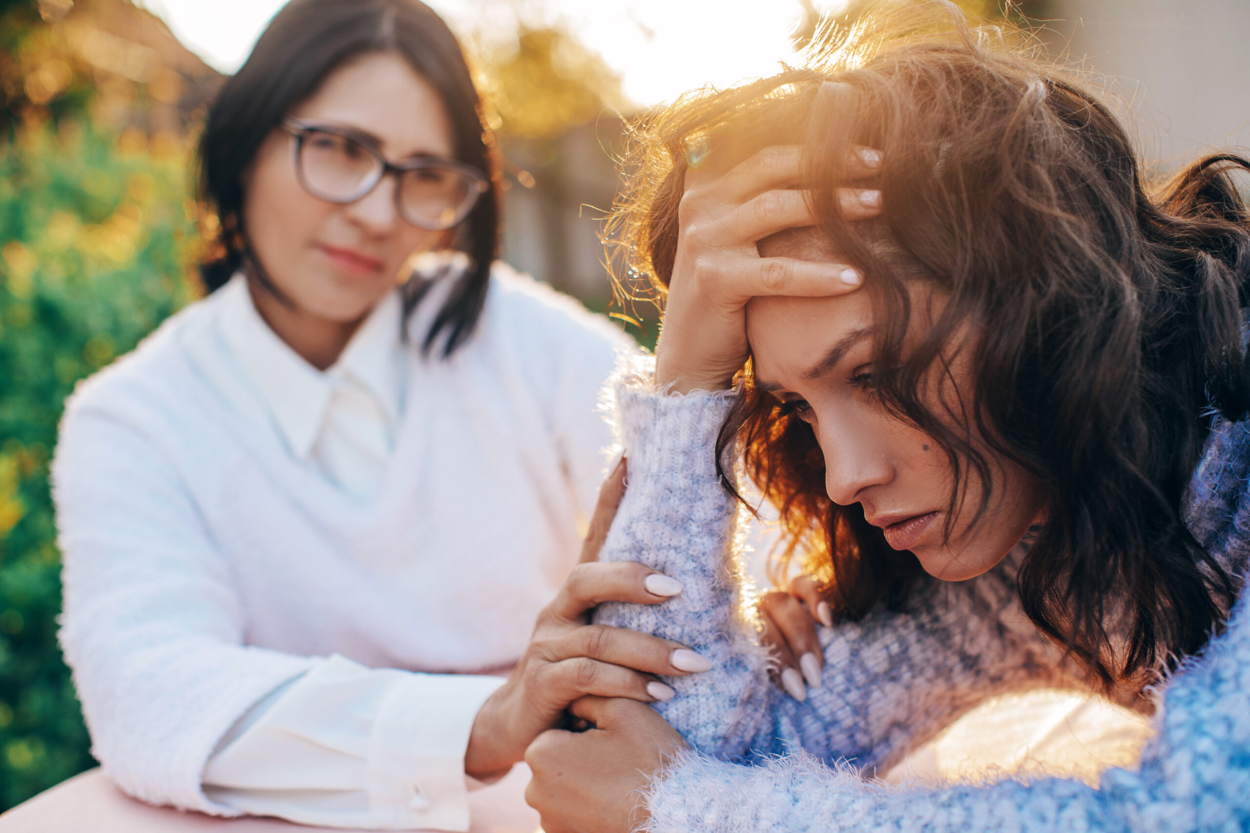 A mother having an intense discussion with her adult daughter.