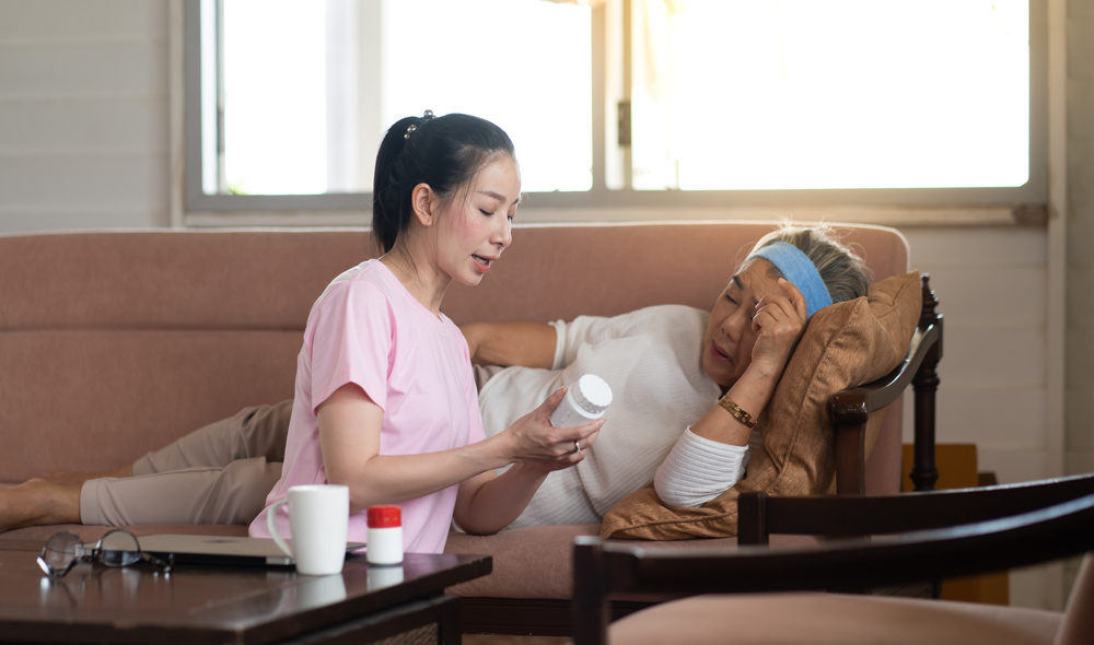An adult daughter taking care of her sick mother