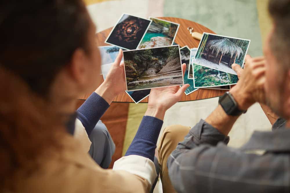 A young couple looking at pictures