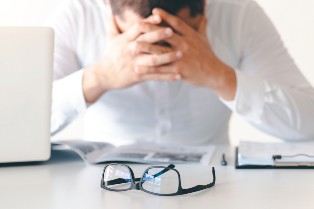 A serious business man sad because he loses his job