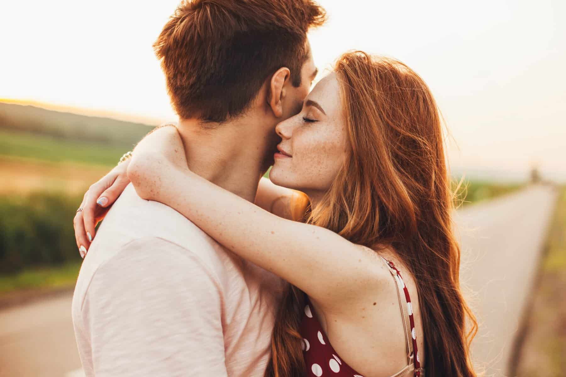A happy couple embracing one another.