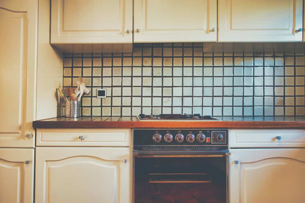 Artistic photo of a kitchen in an older home.