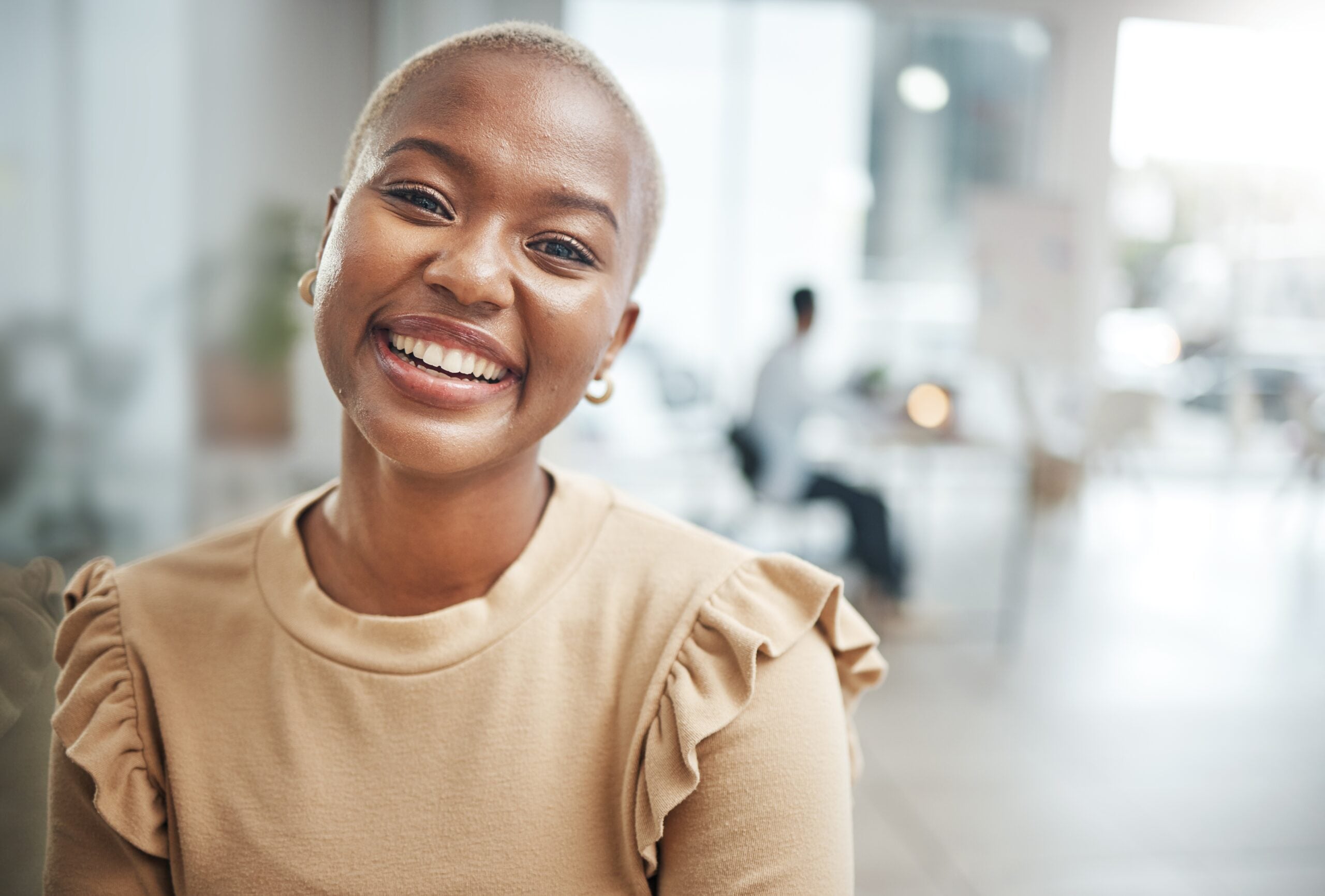 A confident woman at her office.