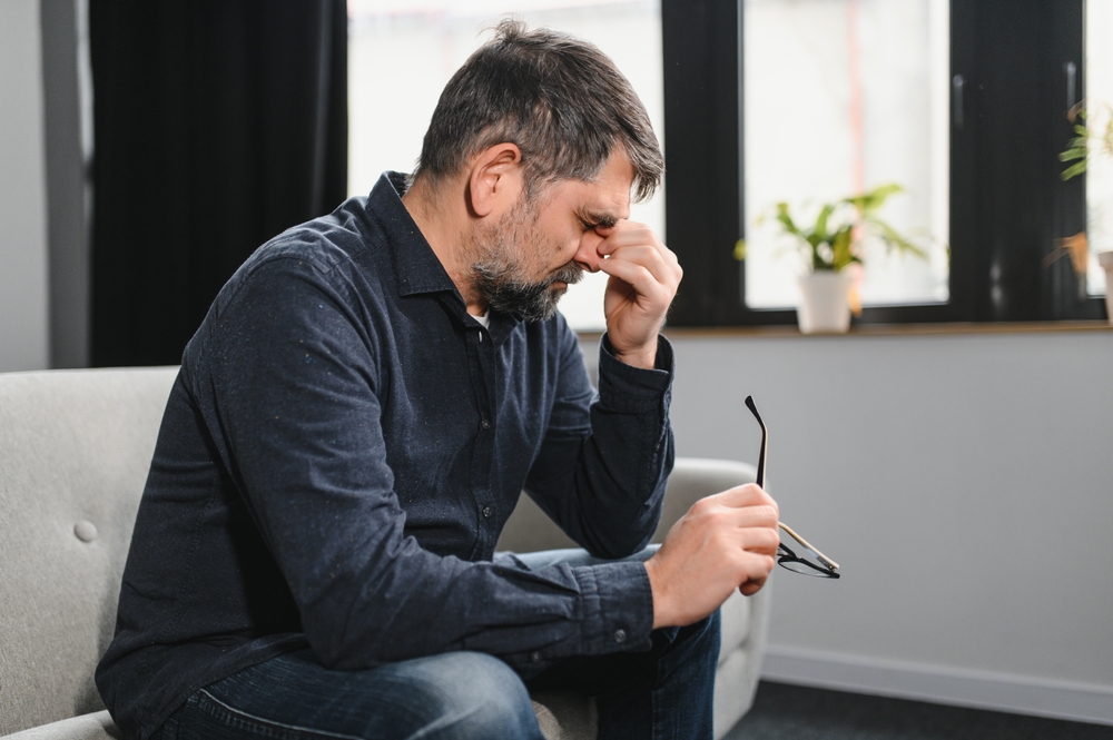A sad and stressed middle age man