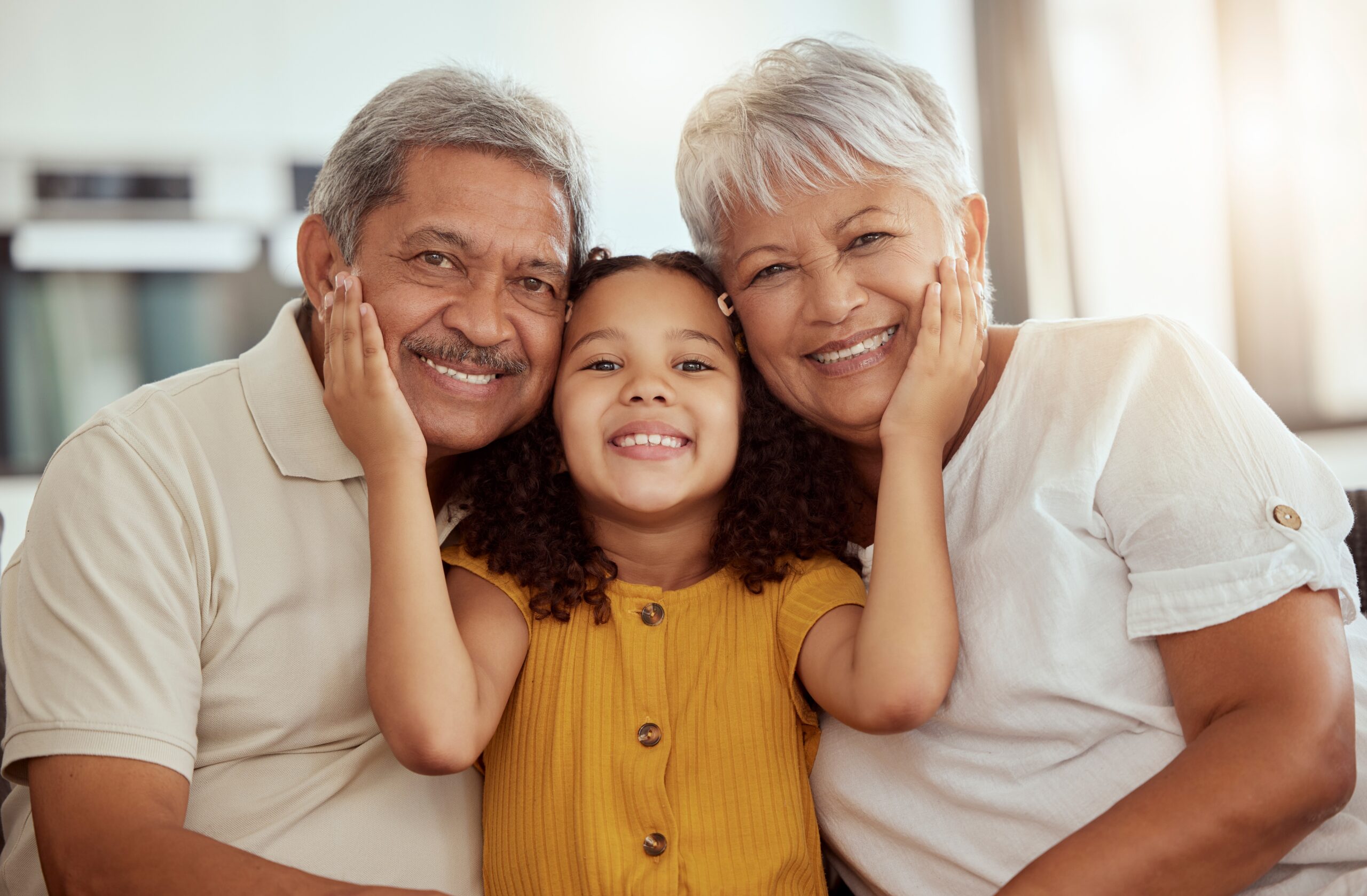 A little girl with her loving grandparents.