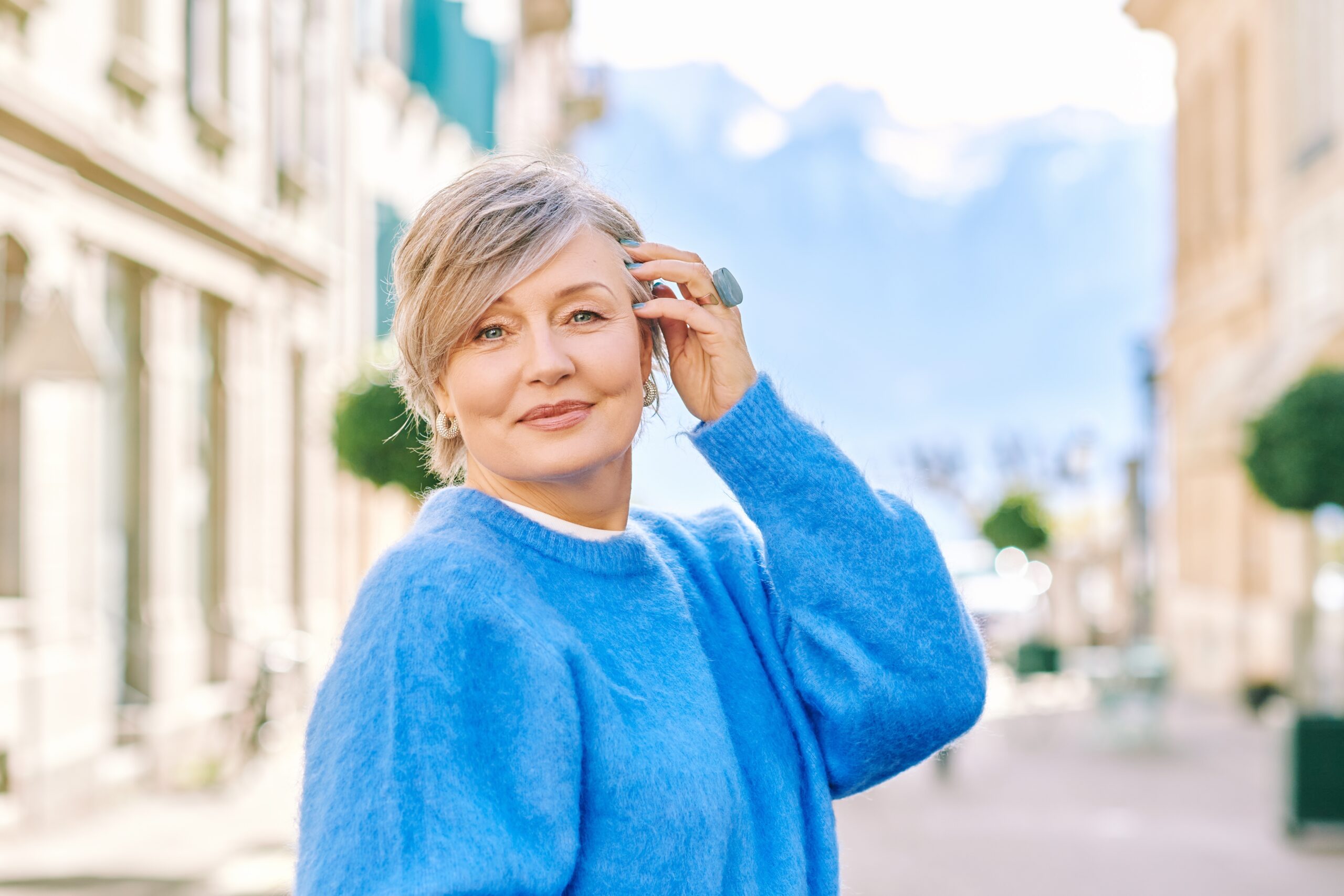 A retired woman enjoying a holiday walk.