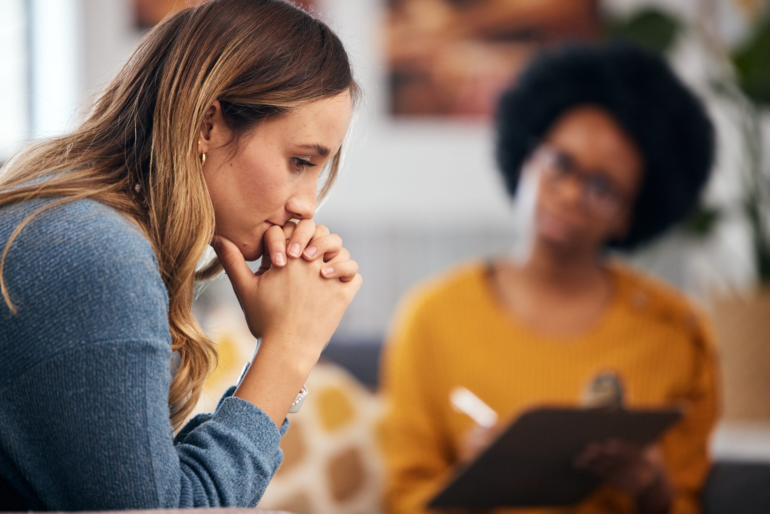 A woman unpacking her childhood during a therapy session.