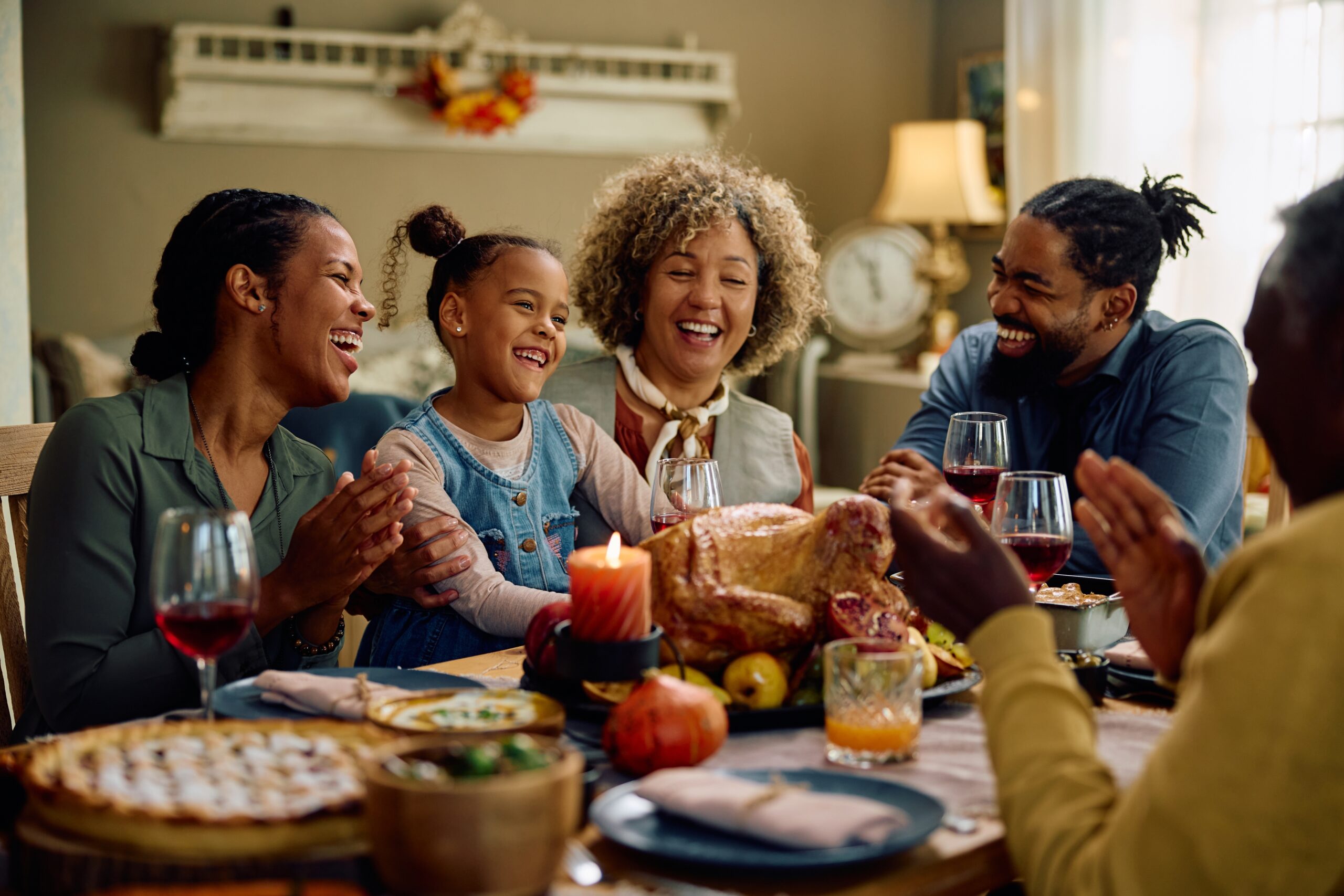 Three generations of a family enjoying dinner together.