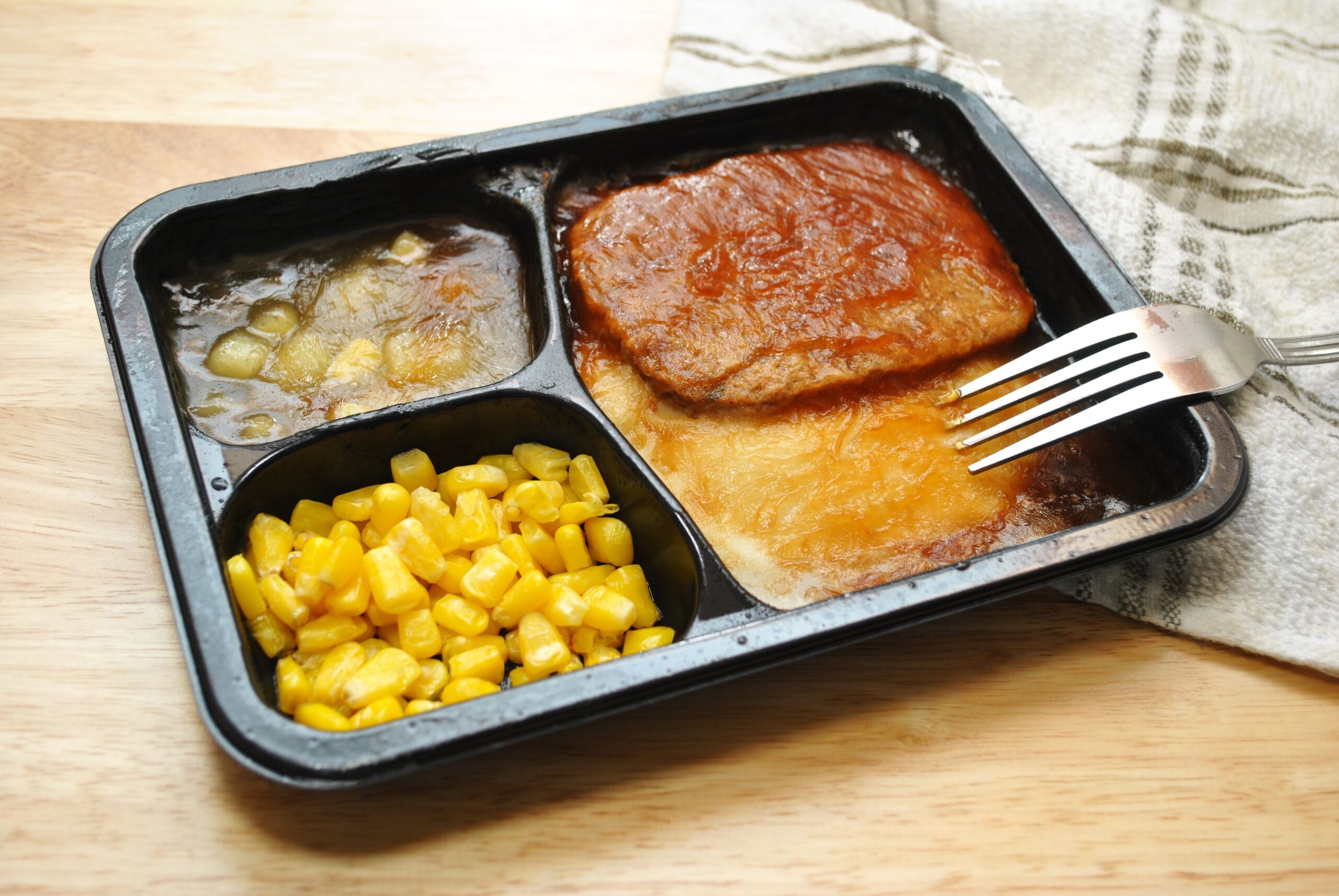 Microwaveable Salisbury steak TV dinner meal.