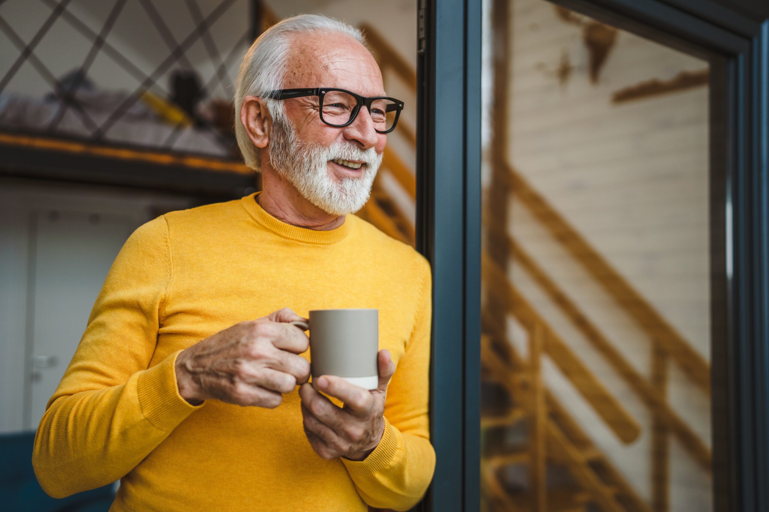 A content retired gentleman enjoying his morning coffee.