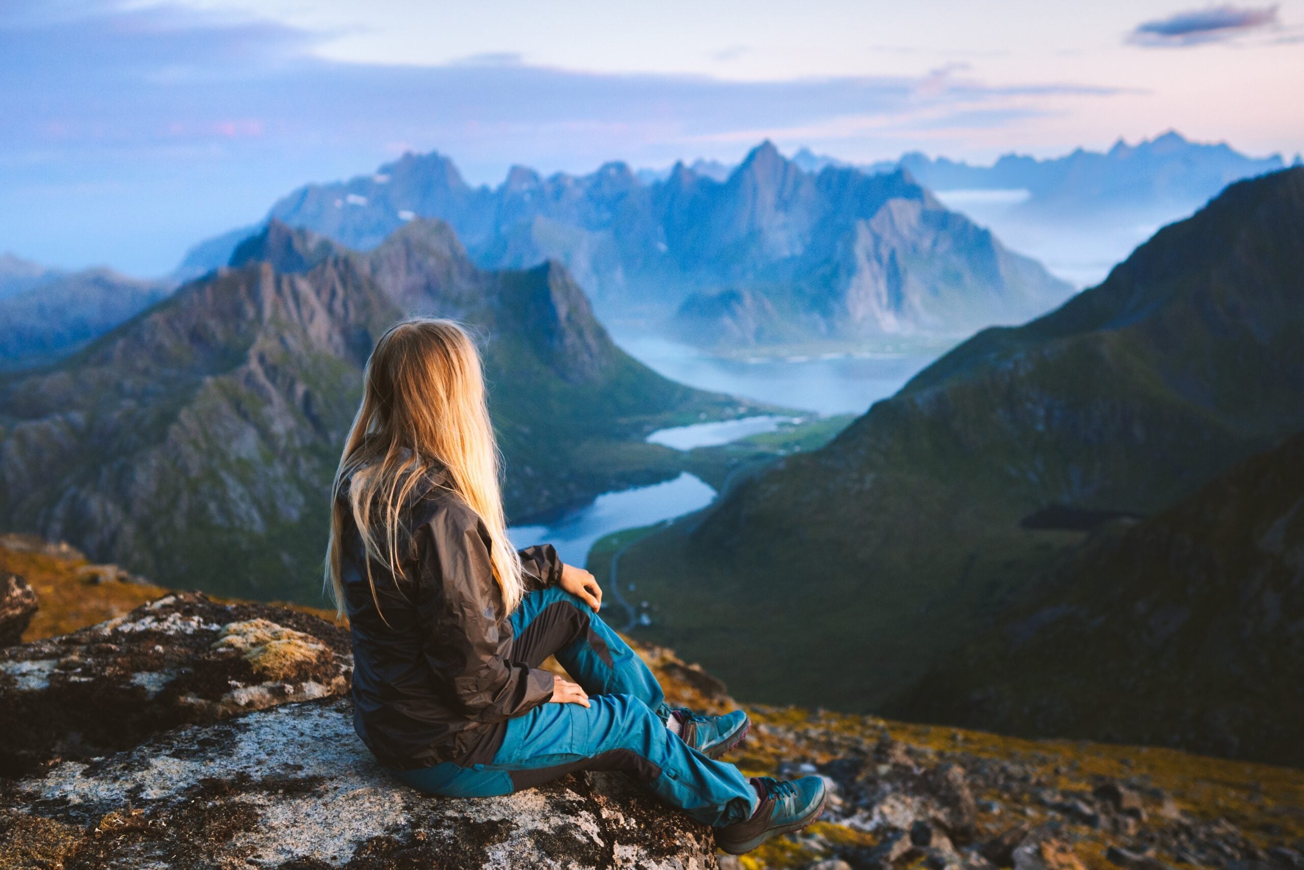 Woman enjoying a mountain view alone.