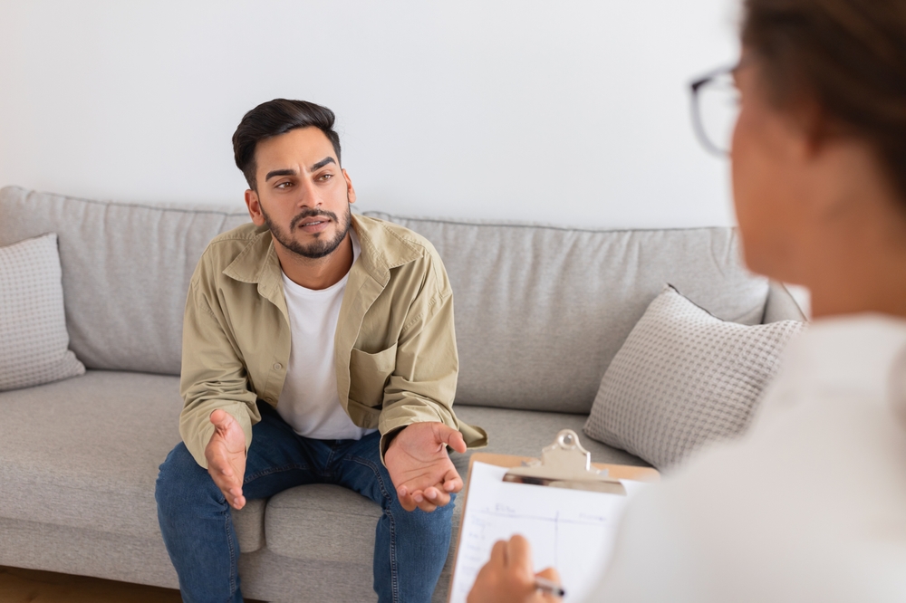 A young man in a therapy session