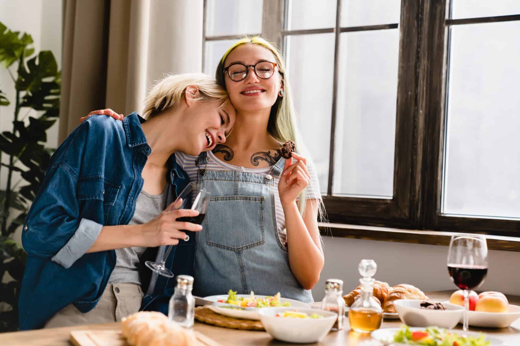 Two close girlfriends enjoying lunch at a cafe.
