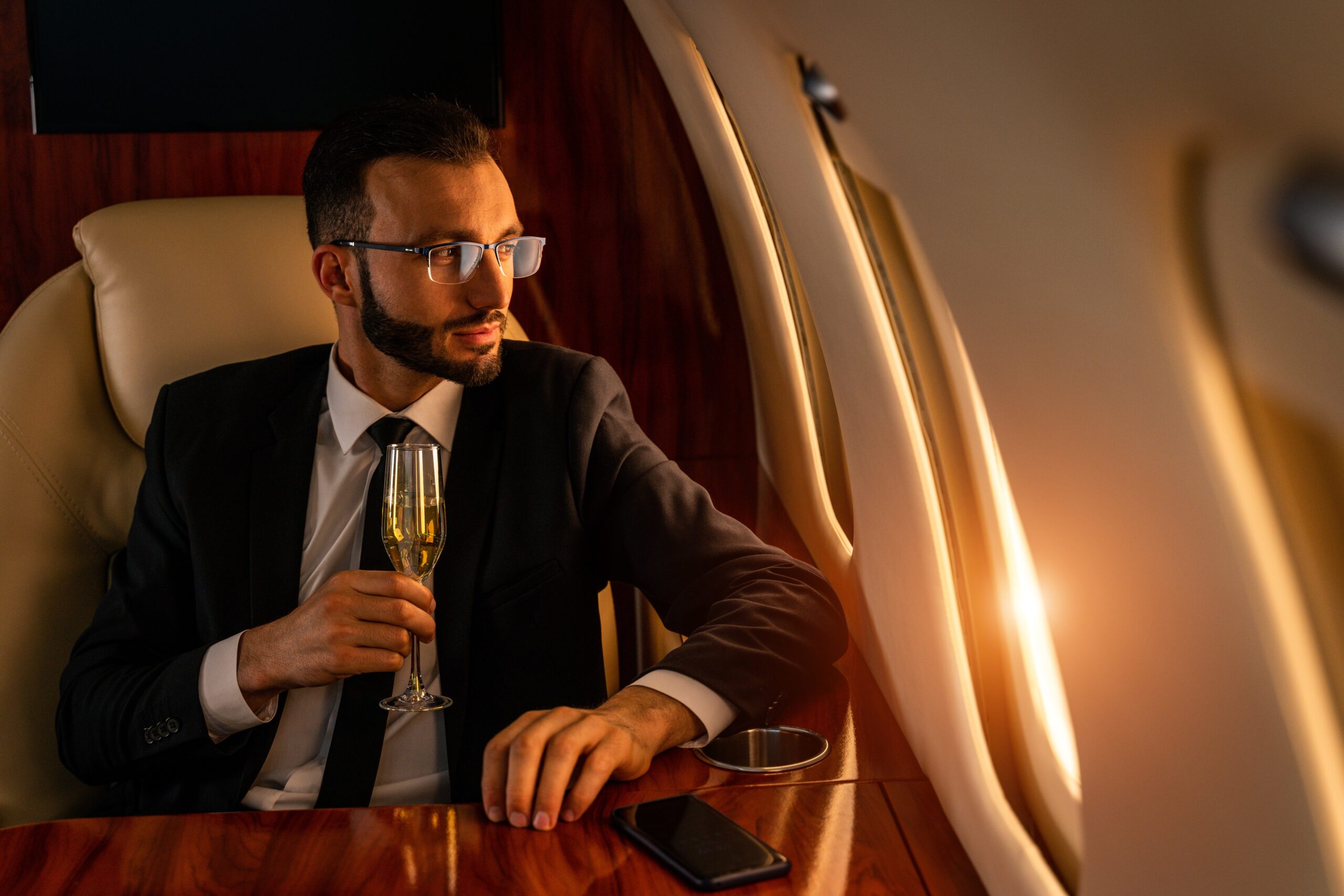 A wealthy man flying in first class.