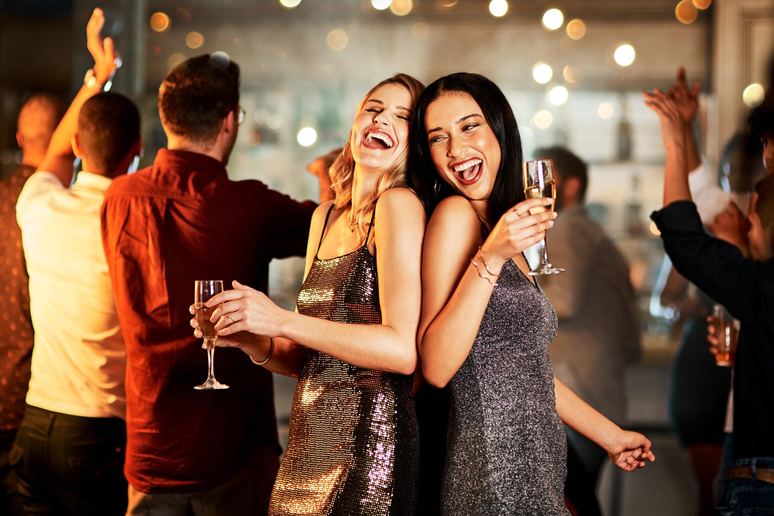 Women having fun on the dance floor at a party.