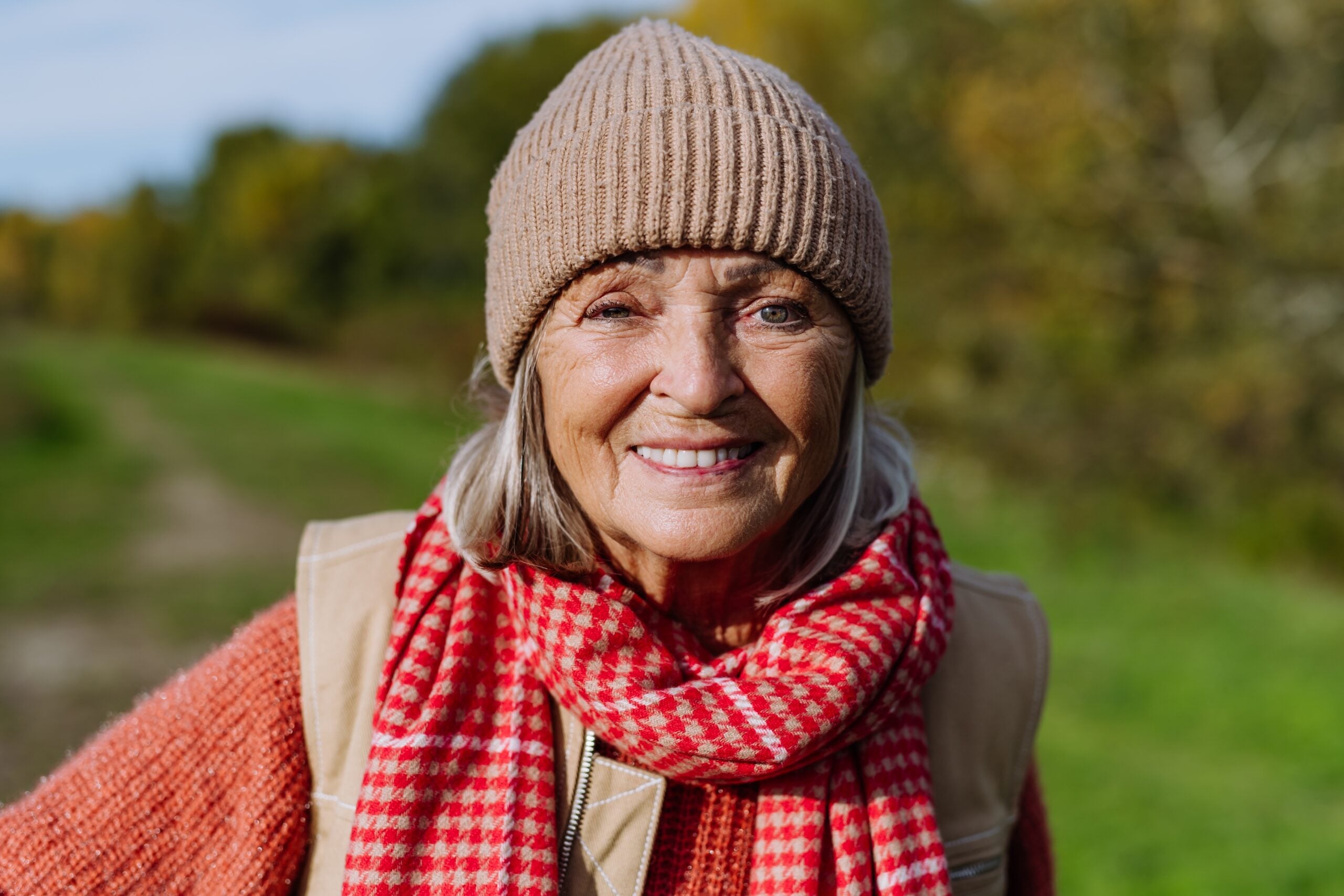 A smiling upbeat mature woman out for a walk.