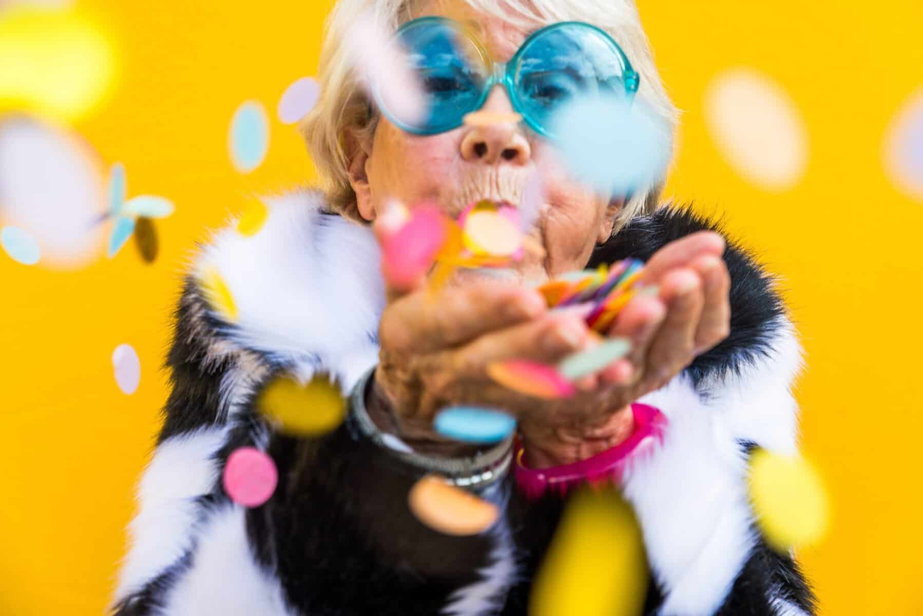 A resilient and happy mature woman enjoying a celebration.