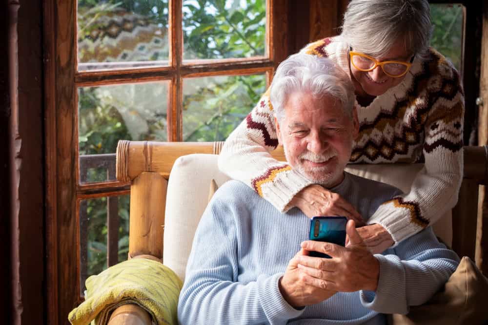 An elderly couple enjoying a moment together.