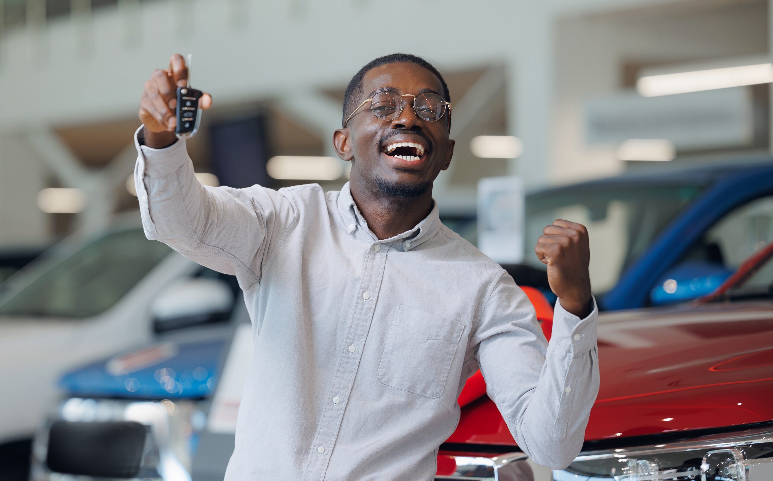 A young man excited about buying his first car.
