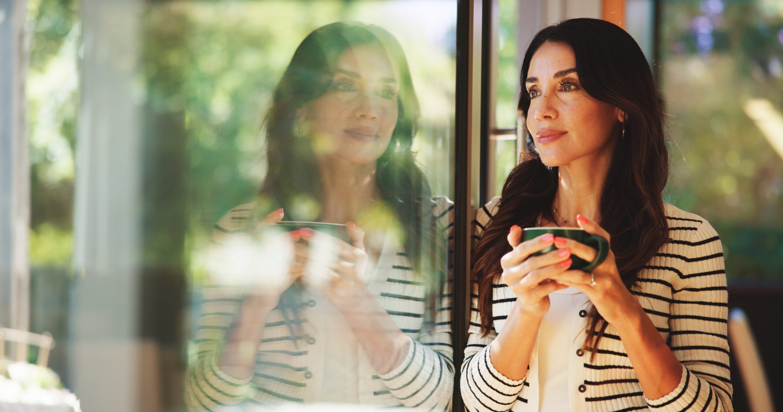 A woman enjoying her black coffee in the morning.
