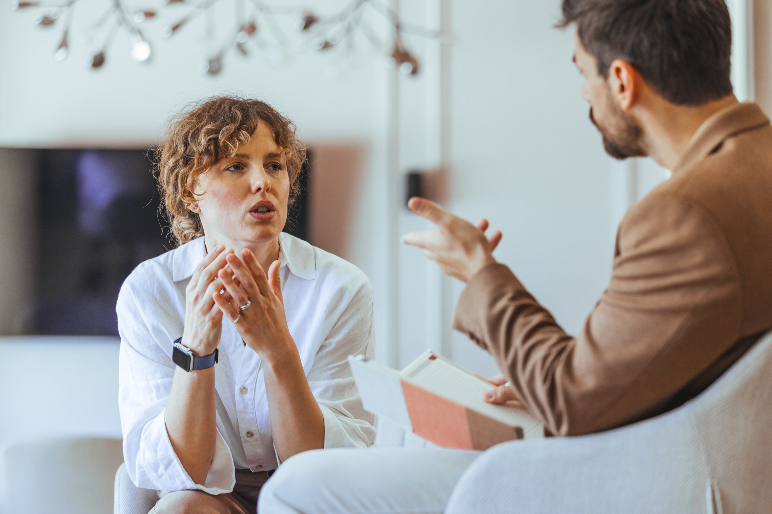 Two people engaged in an intense conversation together.