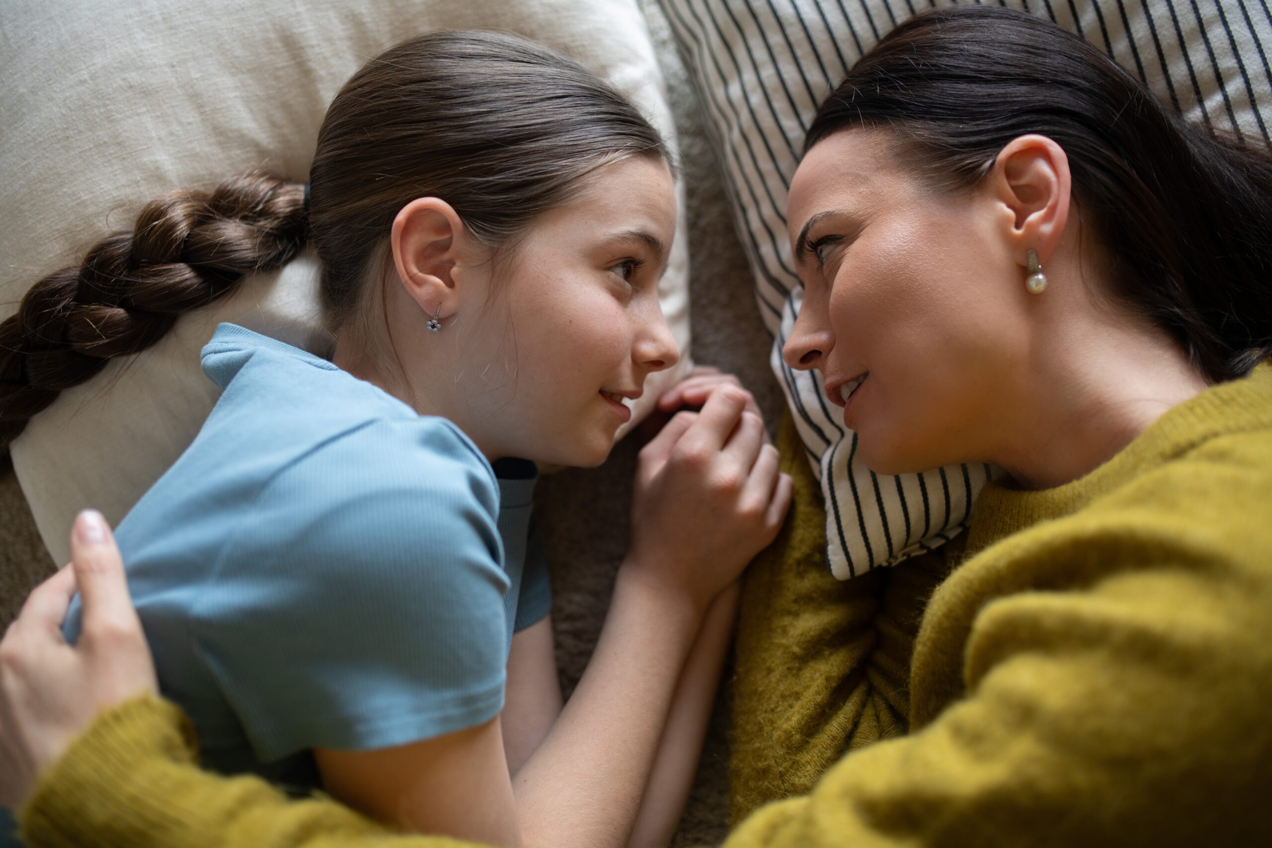A mother reassuring her young daughter that she is fine.