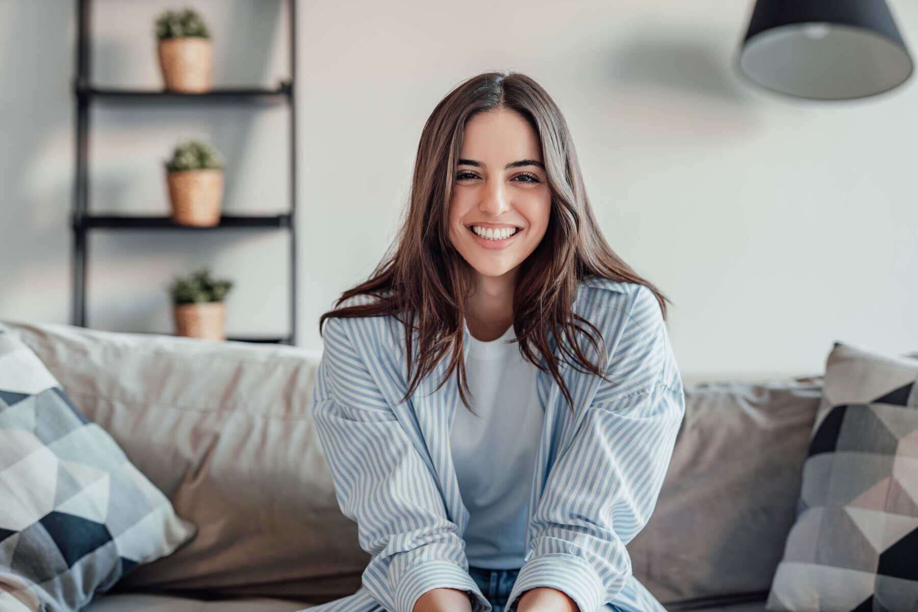 Young woman smiling while enjoying her own company.