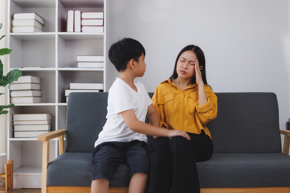A boy comforting his mother