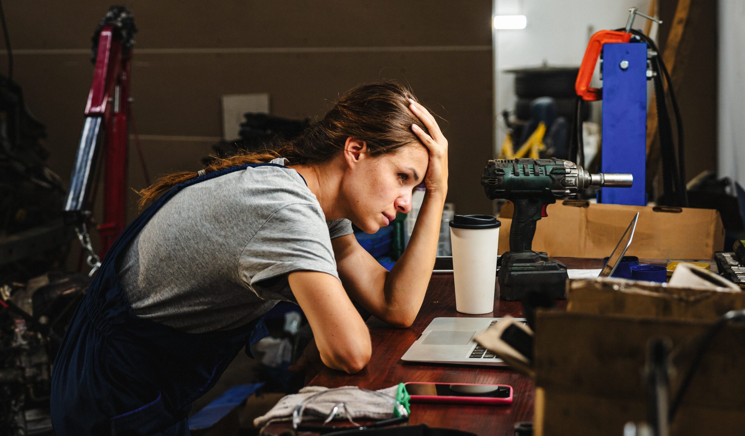 A woman sitting at her desk navigating a crisis on her computer.